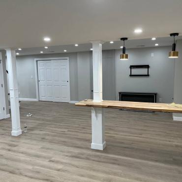 Transformative Basement Finishing with Custom Storage by Sun Shore Construction