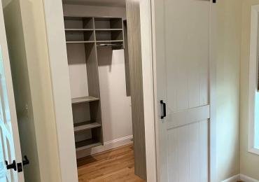 Custom Closet Transformation with Barn Door and Walk-In Feature