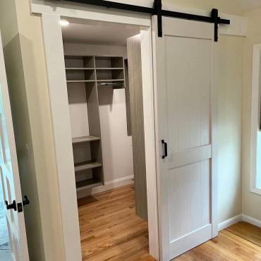 Custom Closet Transformation with Barn Door and Walk-In Feature