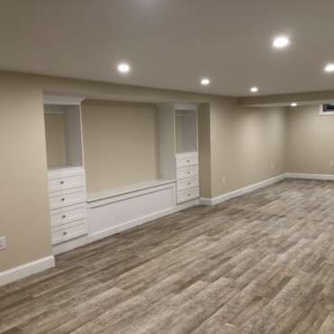 Transformative Basement Finishing with Custom Storage by Sun Shore Construction