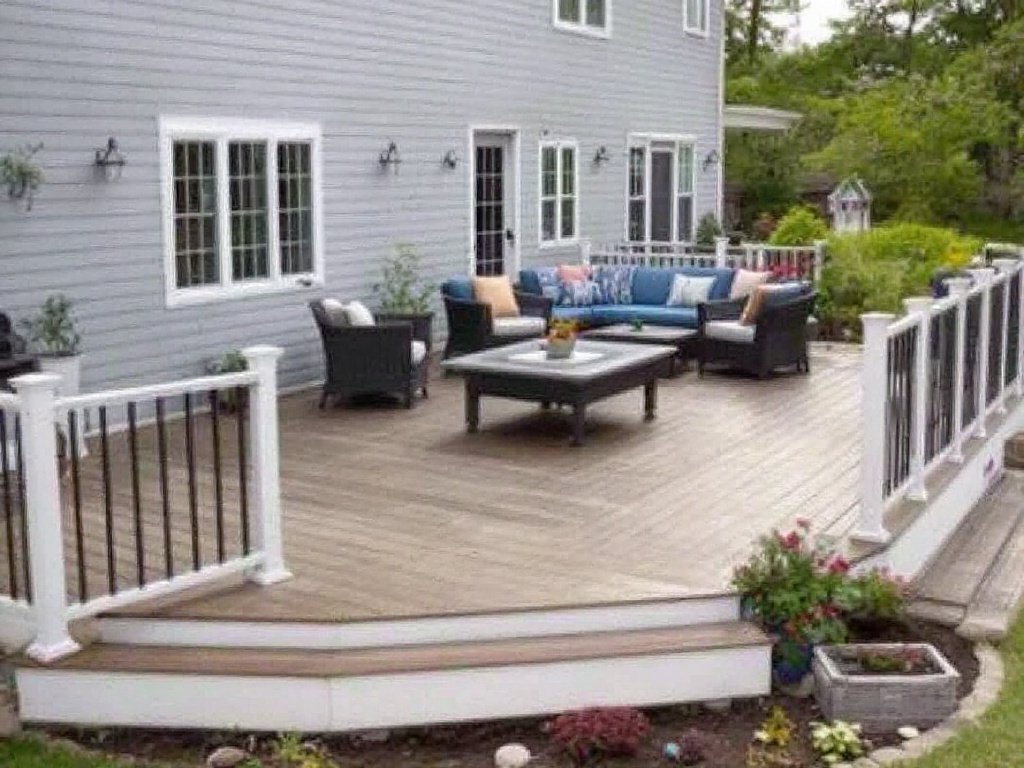 Man in outdoor setting, professionally installing wooden deck at a residence in Quincy, MA'