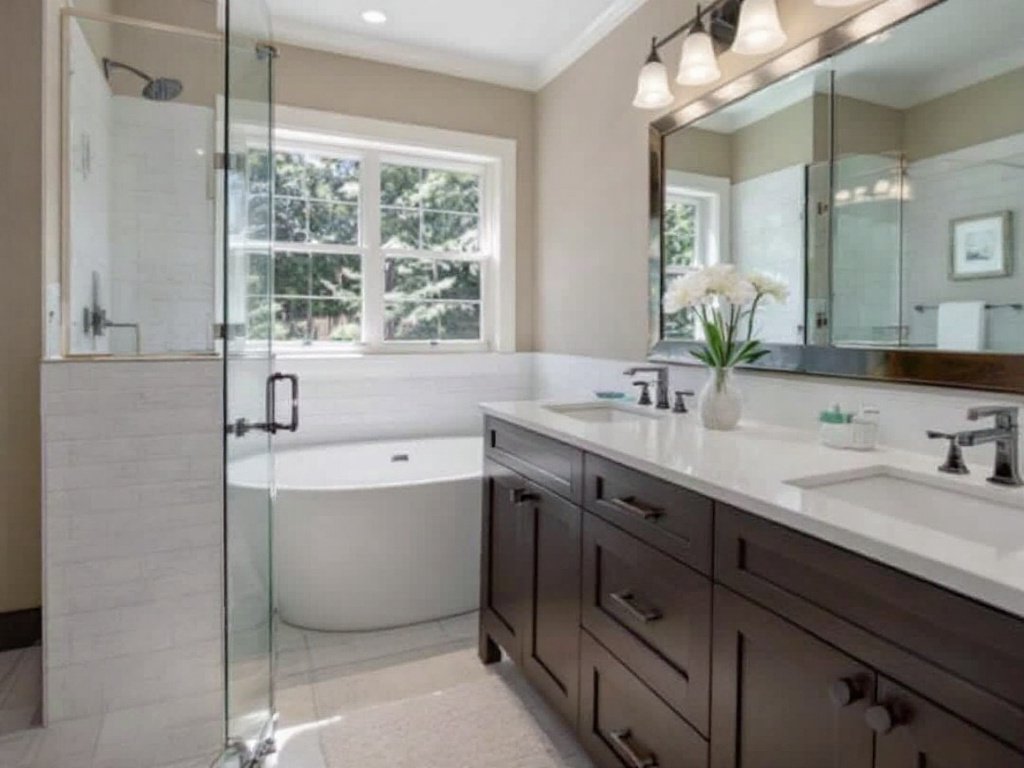 Caption: Trust in the Expertise of Norwood’s Top Construction Contractors to Bring a Modern Touch to Your Bathroom Remodel. Experienced construction contractors executing a contemporary and modern bathroom remodel in Norwood, MA.