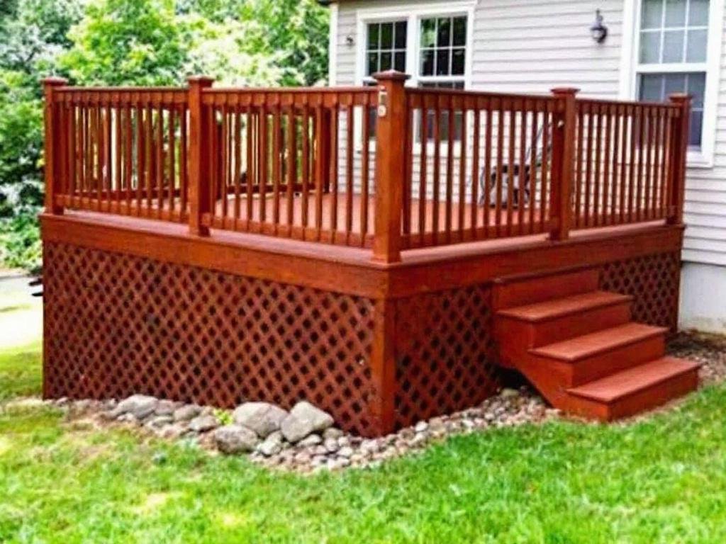 Caption: A beautifully created deck installation in Walpole, offering a perfect blend of modern and contemporary design to enhance your outdoor environment. Modern and contemporary design of a top-quality deck installation in Walpole, MA, enhancing outdoor living spaces.