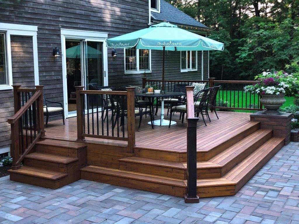 Caption: Experience a transformation! Featuring the freshly installed, contemporary-styled deck in Sudbury, MA. Sleek, modern deck installation transforming an outdoor space in Sudbury MA.