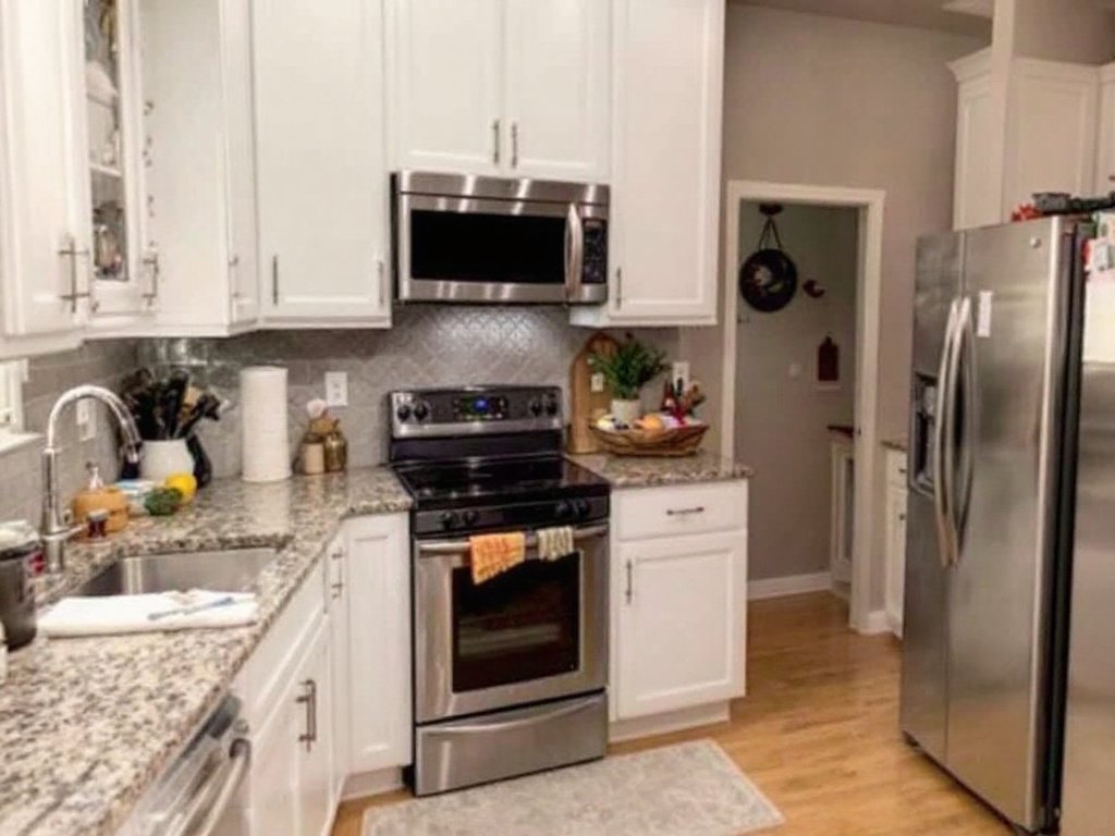 Modern kitchen interior post-renovation by professional contractors near Dover, MA.