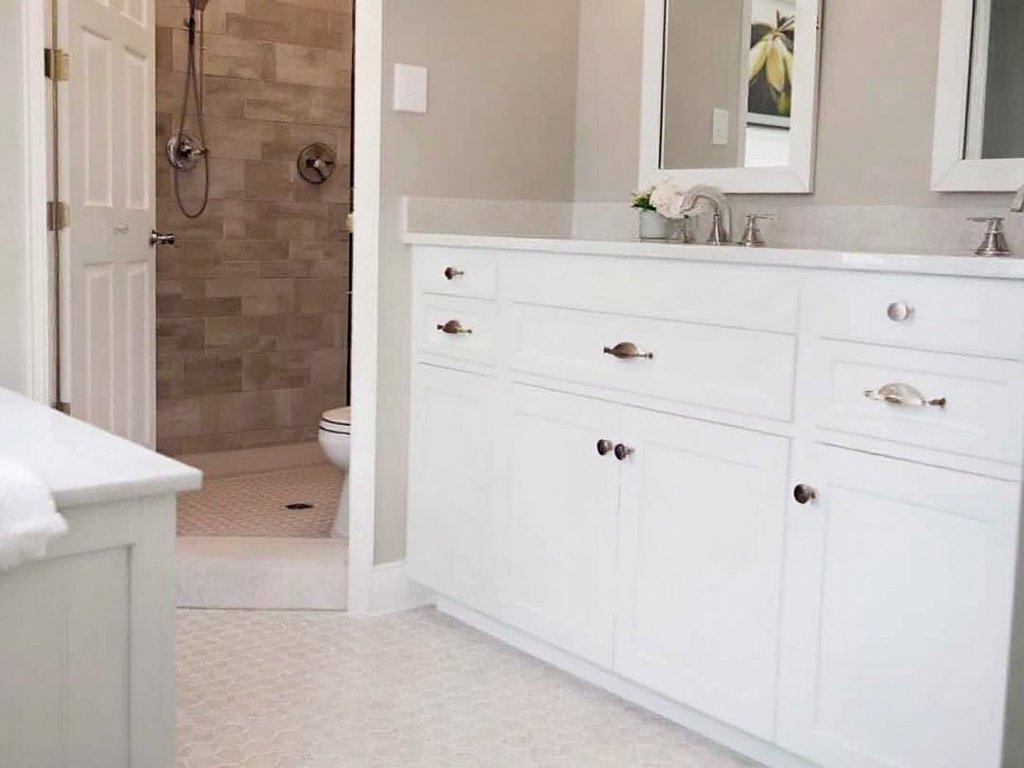 Expert tile installation contractors completing a modern bathroom remodeling project in Dedham, MA.