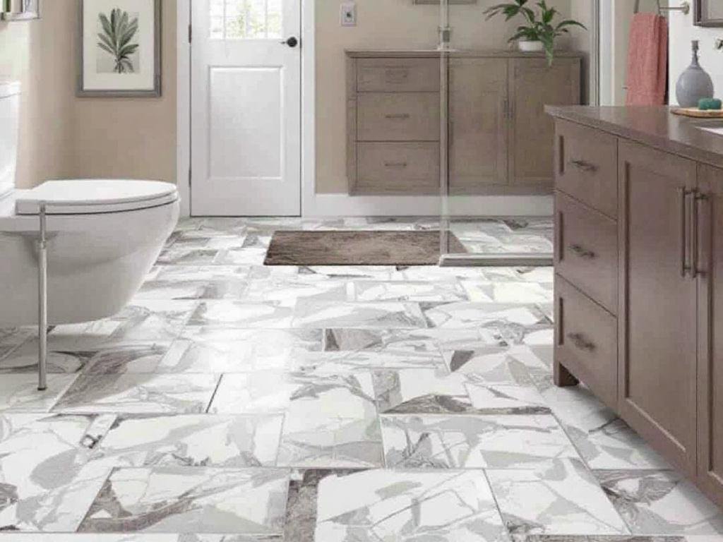 Professional tile installers working on flooring near Sudbury, MA.