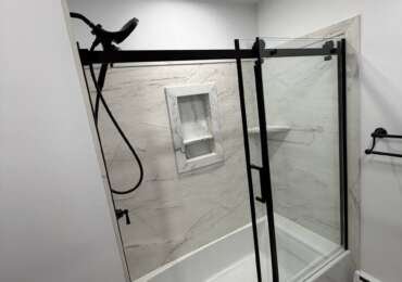 Bathroom Renovation in Norwood, MA | Bathtub, Sliding Glass Door & Marble-Look Tile