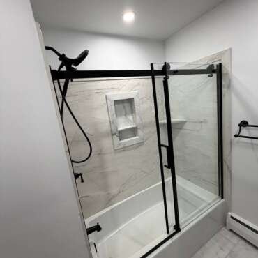 Bathroom Renovation in Norwood, MA | Bathtub, Sliding Glass Door & Marble-Look Tile