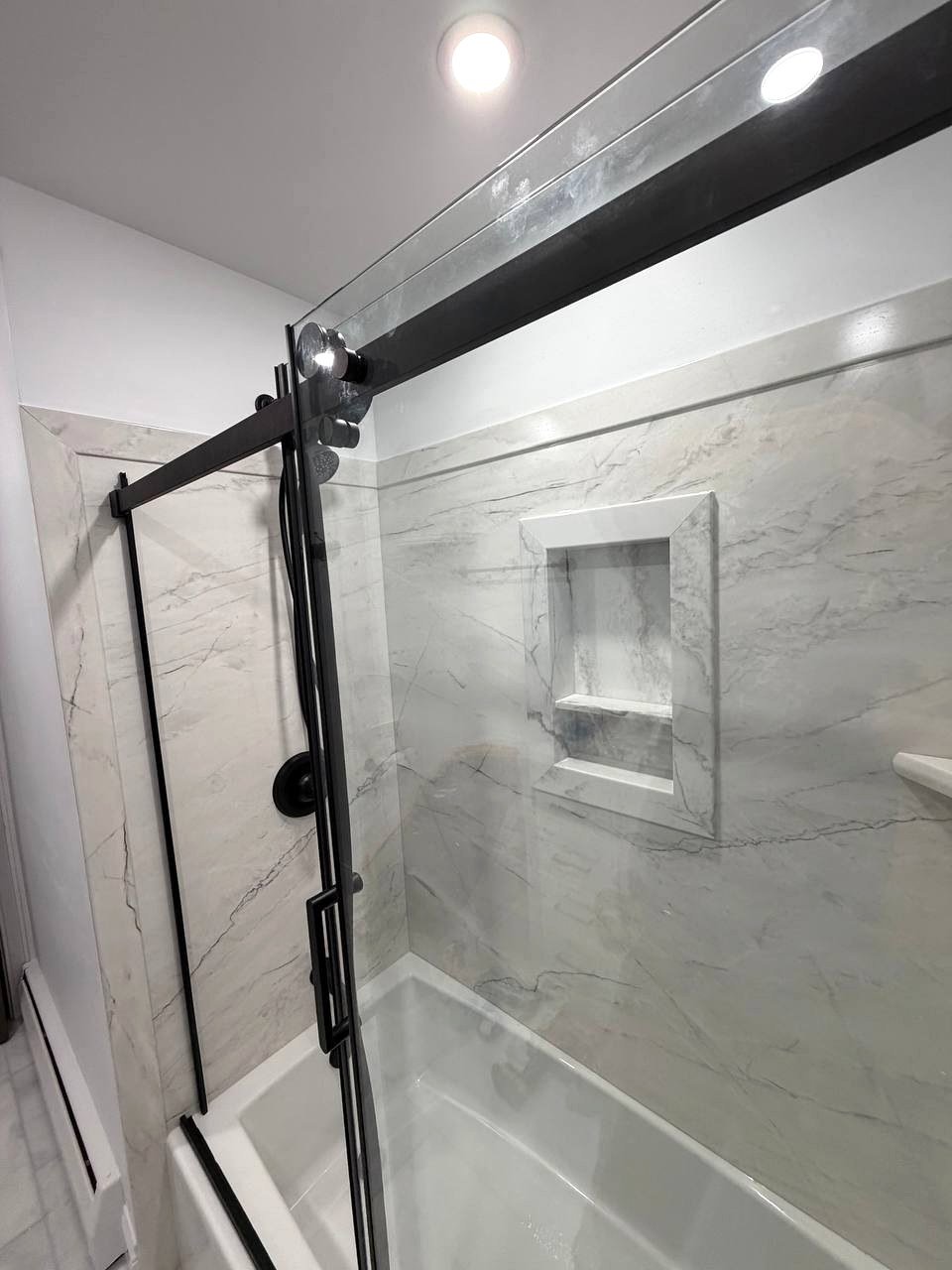 Bathroom remodel Norwood MA - recessed ceiling lights and shower niche detail