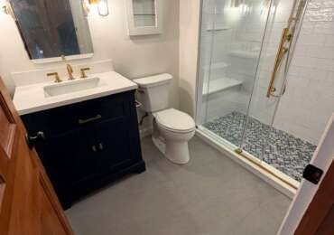 Bathroom Renovation in Westwood, MA | Navy Vanity, Walk-In Shower & Gold Fixtures