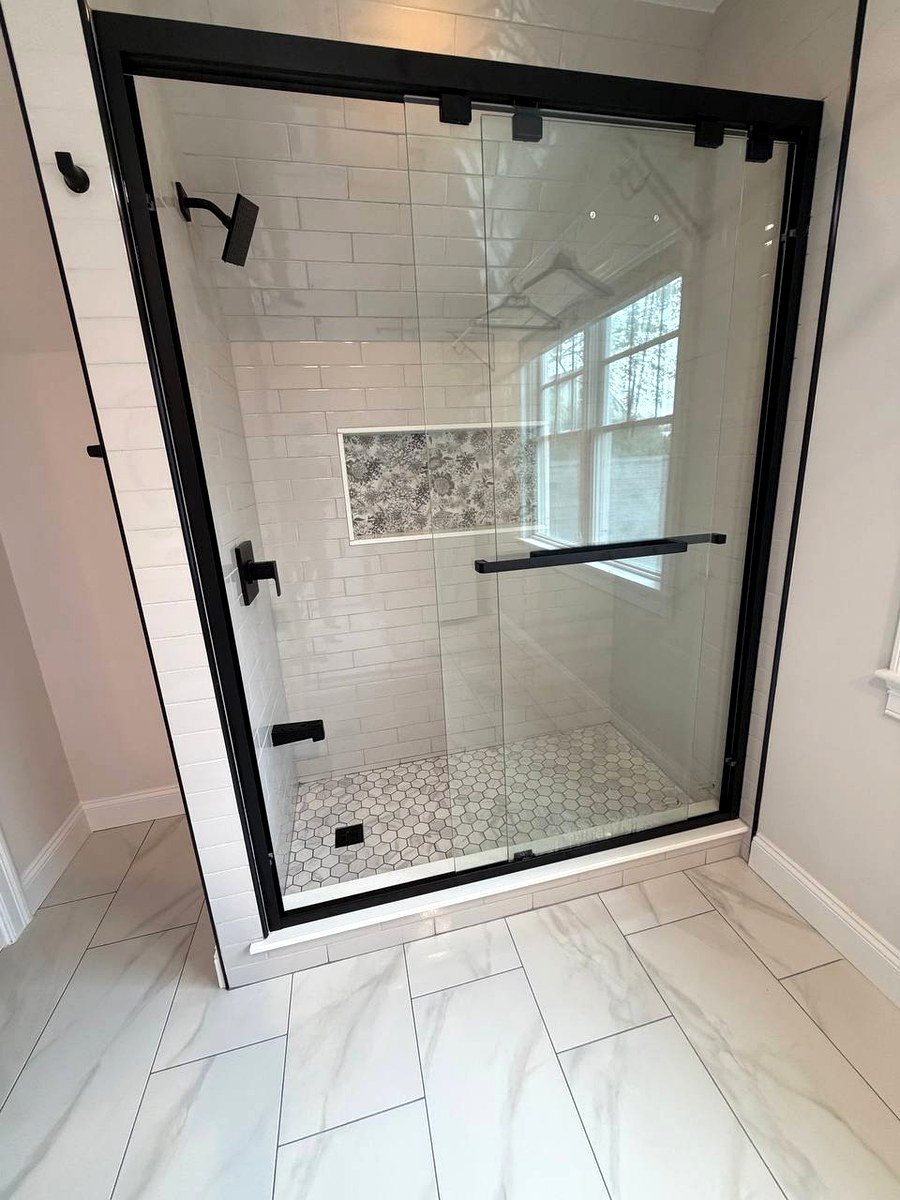 Walk-in shower glass door Newton Center MA - black matte frame with hex mosaic shower floor tiles