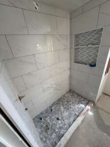 needham-2nd-floor-bathroom-during-pebble-shower-floor