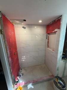 needham-2nd-floor-bathroom-during-shower-wall-tile-and-niche