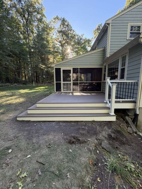 Front view of Trex deck with wide wraparound steps, Acton MA