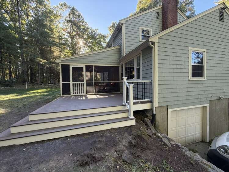 Side view of composite deck with white and black railing, Acton MA